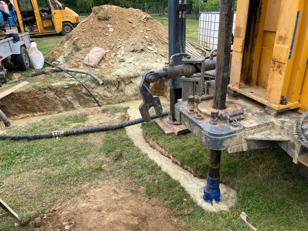 Mud drilling for water well borehole, rotary drill rig operates with mud pump circulating bentonite slurry at drilling site